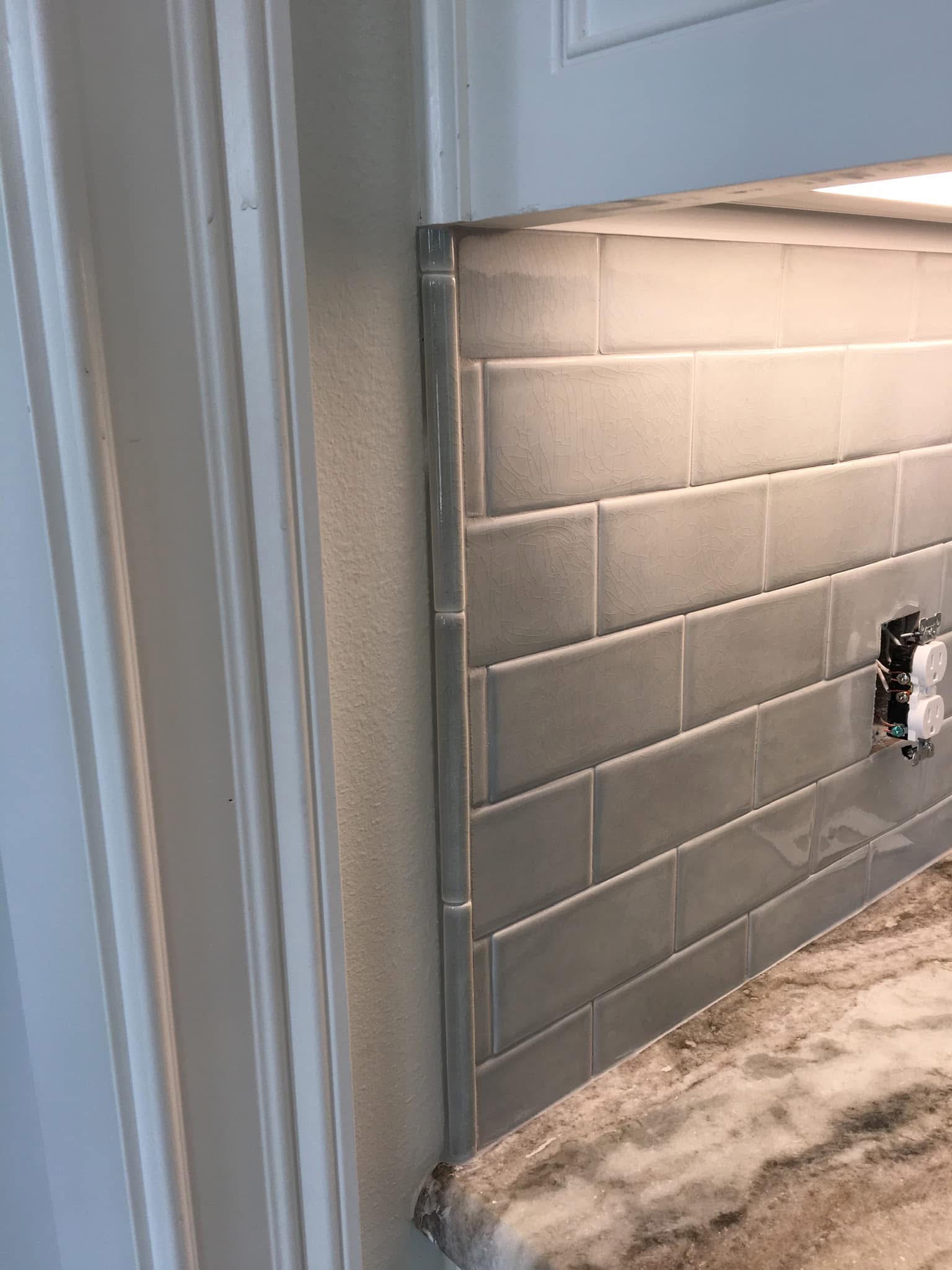 Gray subway tile backsplash detail