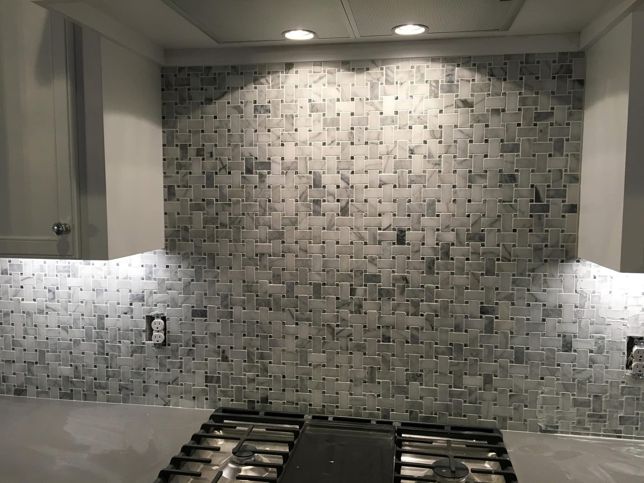 Mosaic tile backsplash under kitchen cabinets