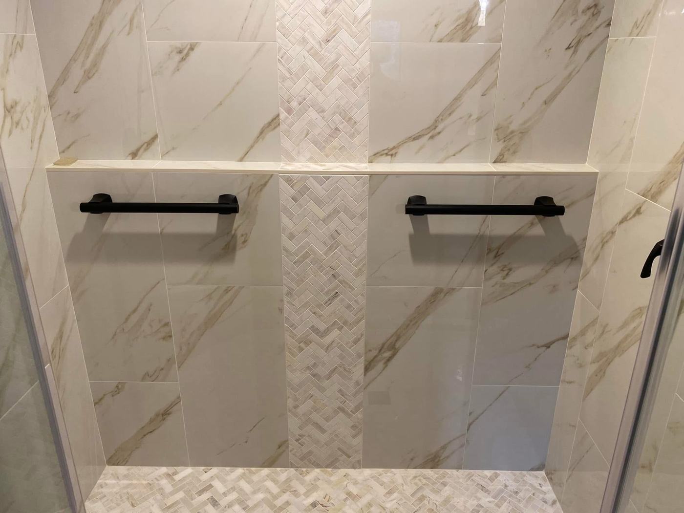 Two shower benches with black grab bars