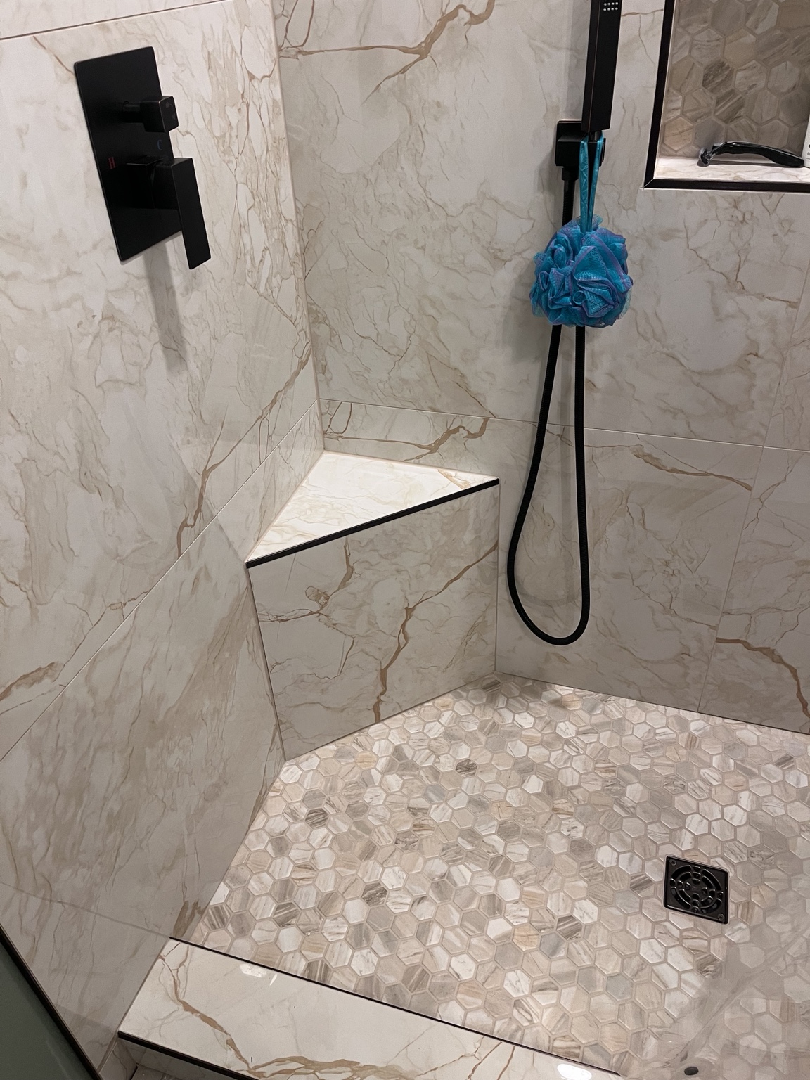 Corner shower bench with handheld fixture