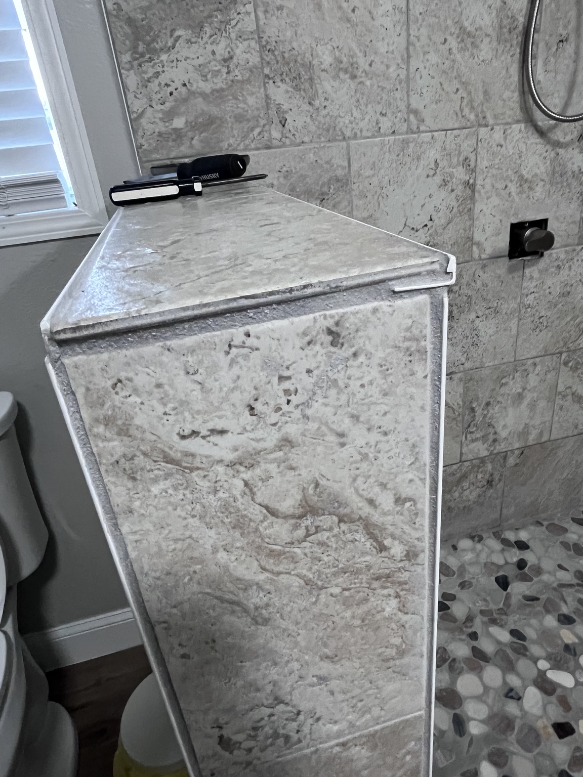 Tiled bench in Shawna’s earlier shower